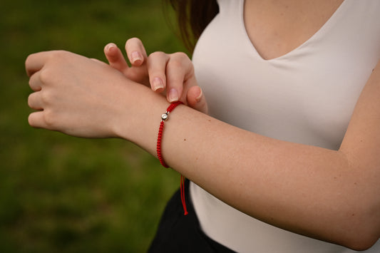 Silver Bracelet on a red thread with a Zirconia stone