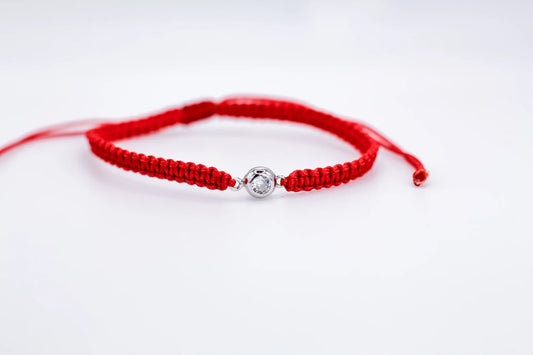 Silver Bracelet on a red thread with a Zirconia stone